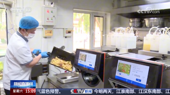 CCTV news footage featuring YAO MASTER cooking machines